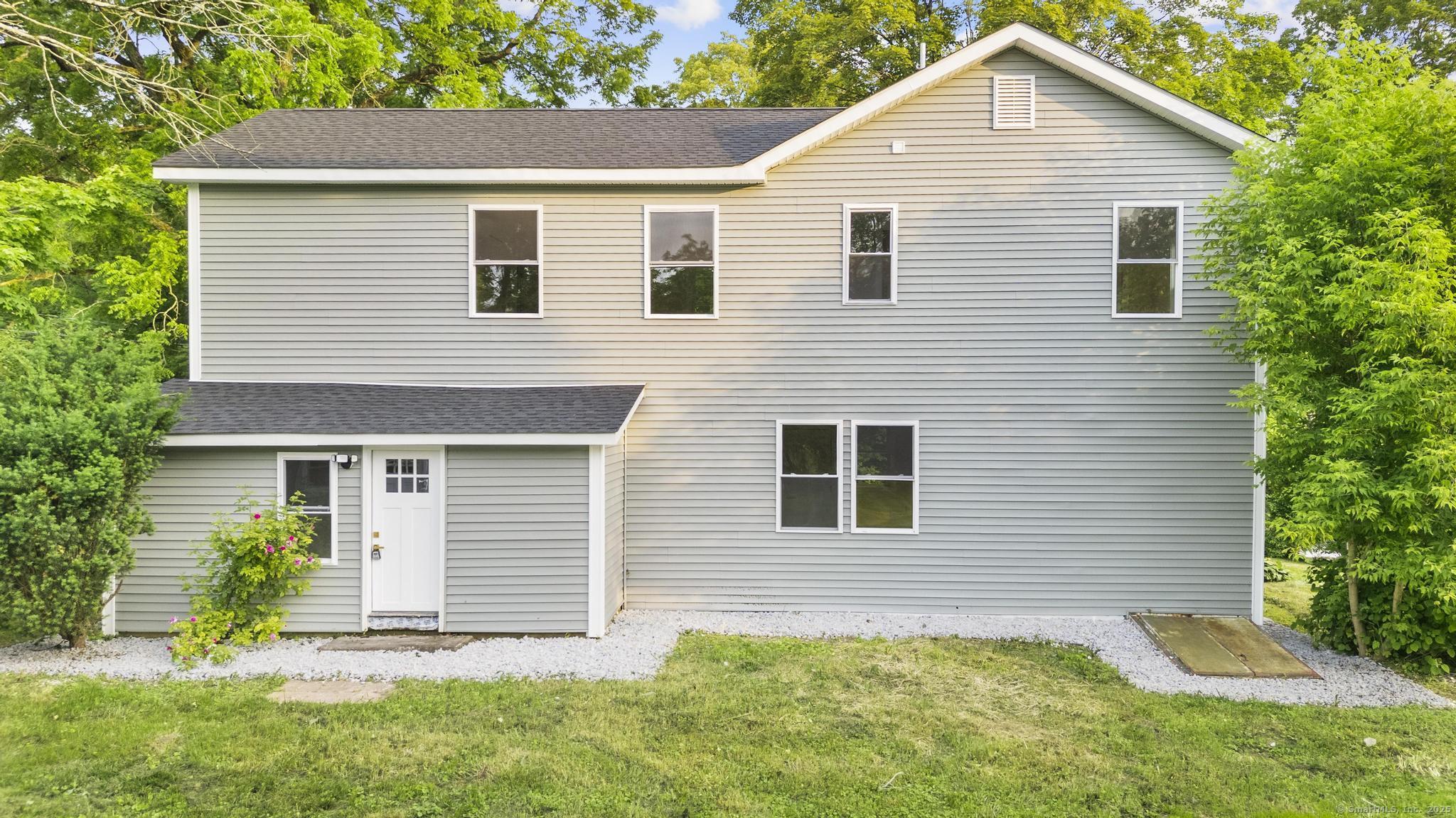 123 Lower Road North Canaan, CT 06024 - Photo 35 of 38 a view of a house with a yard and potted plants