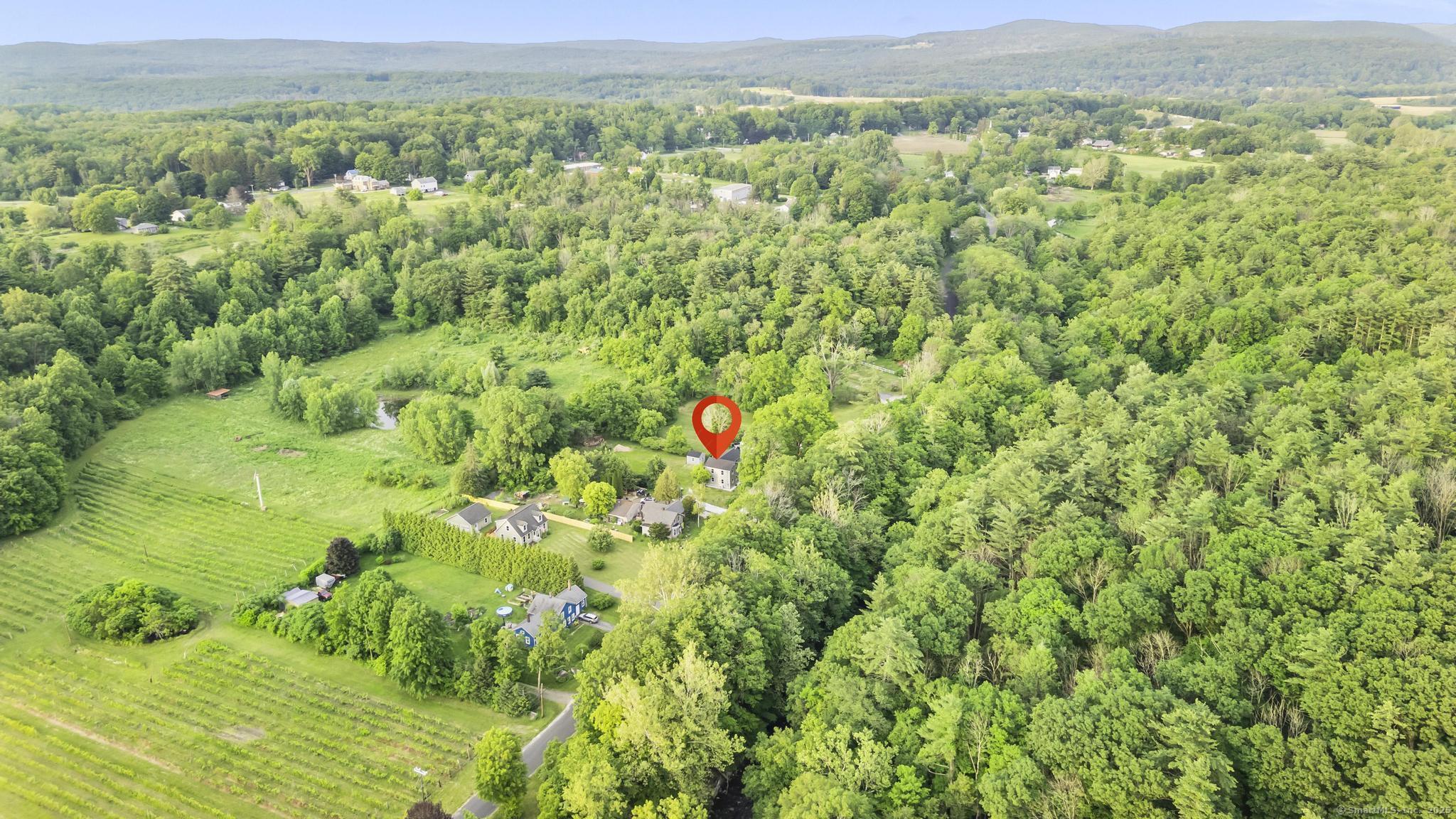 123 Lower Road North Canaan, CT 06024 - Photo 37 of 38 a aerial view of a houses with a lush green hillside