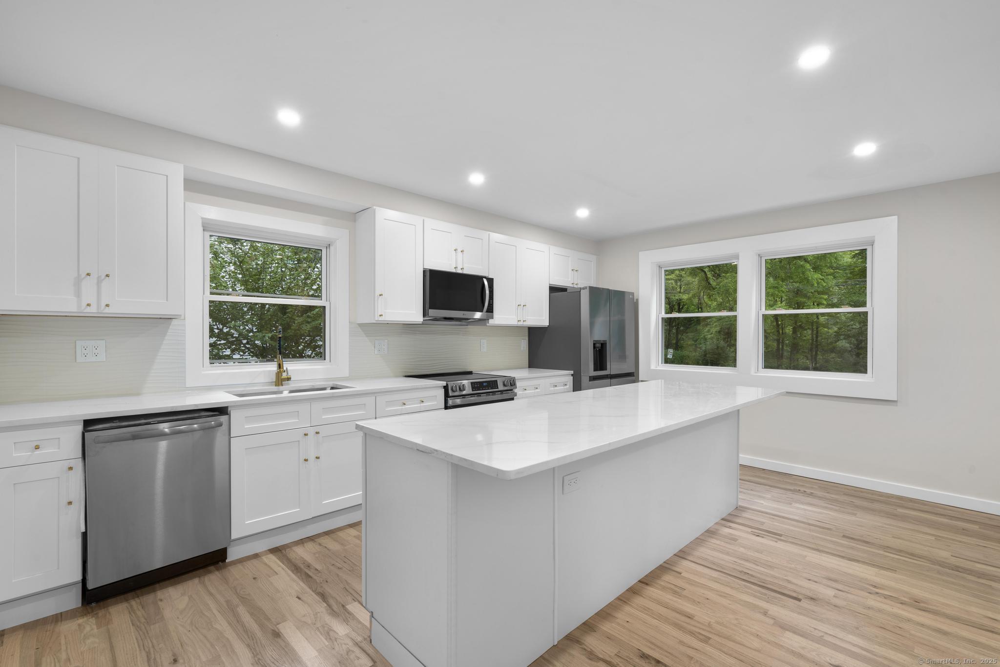 123 Lower Road North Canaan, CT 06024 - Photo 4 of 38 a large white kitchen with a large window
