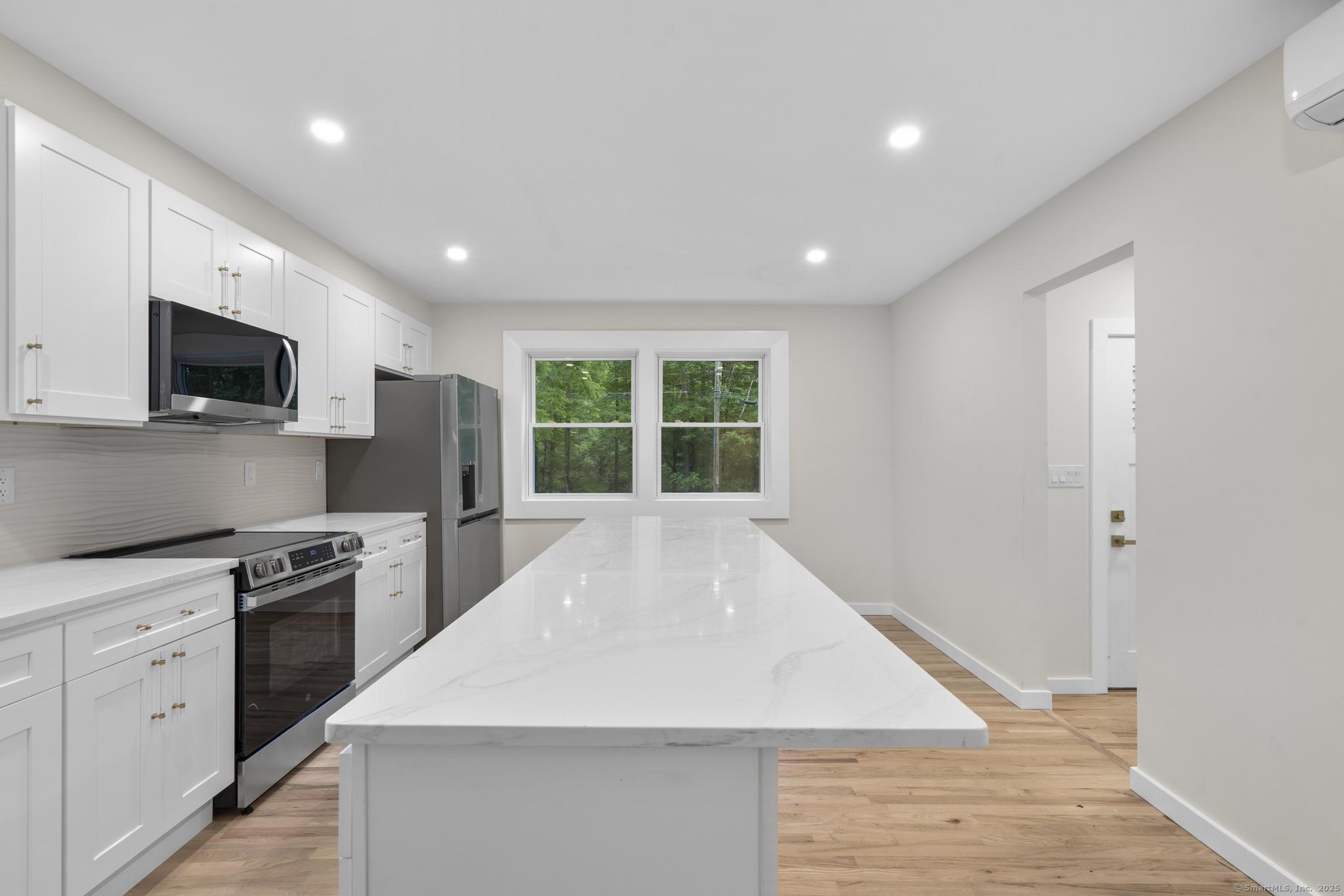 123 Lower Road North Canaan, CT 06024 - Photo 6 of 38 a large kitchen with kitchen island a sink stainless steel appliances and cabinets