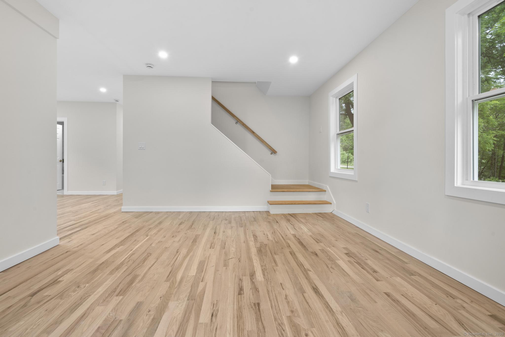 123 Lower Road North Canaan, CT 06024 - Photo 8 of 38 an empty room with wooden floor and windows