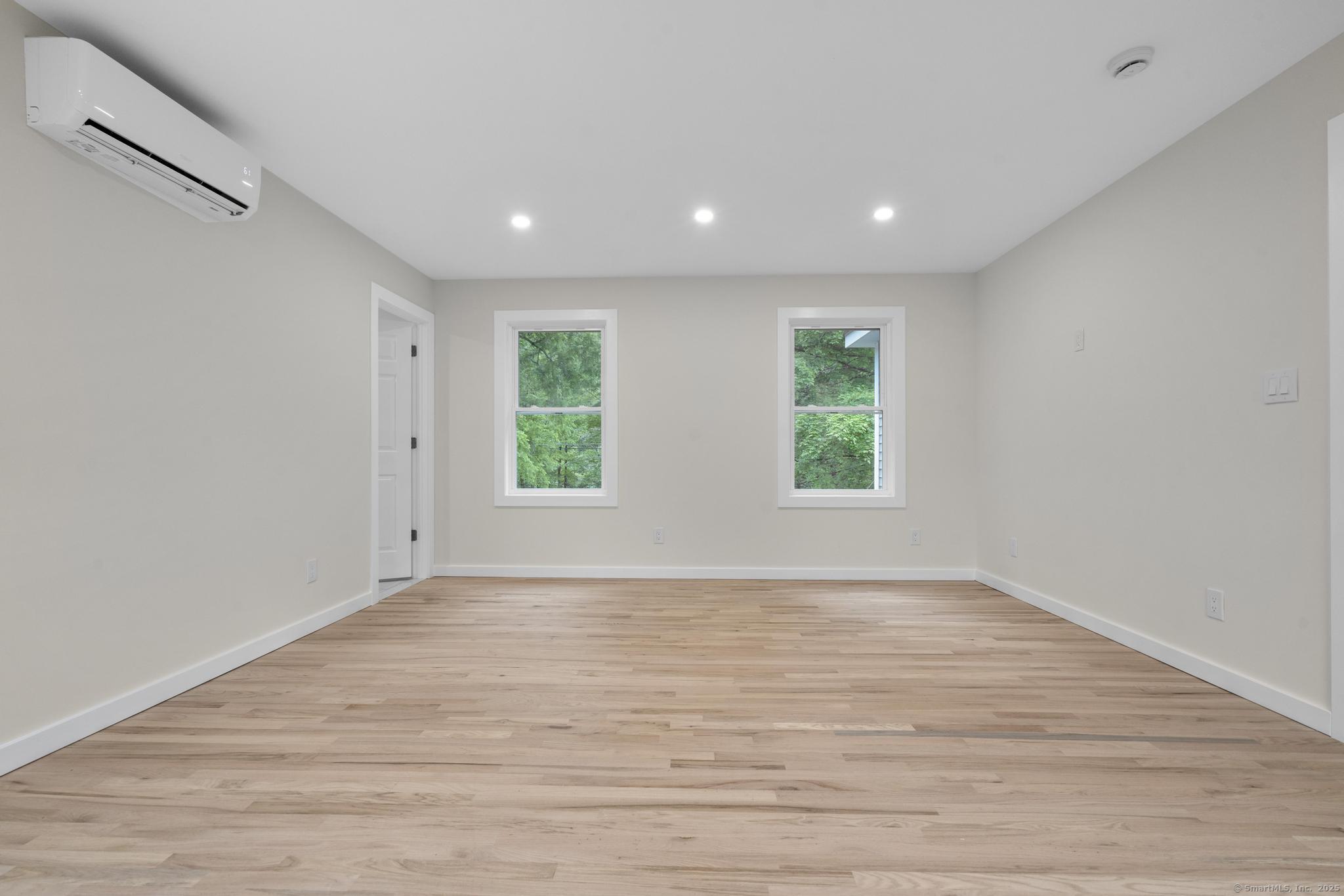 123 Lower Road North Canaan, CT 06024 - Photo 10 of 38 a view of an empty room with wooden floor and a window