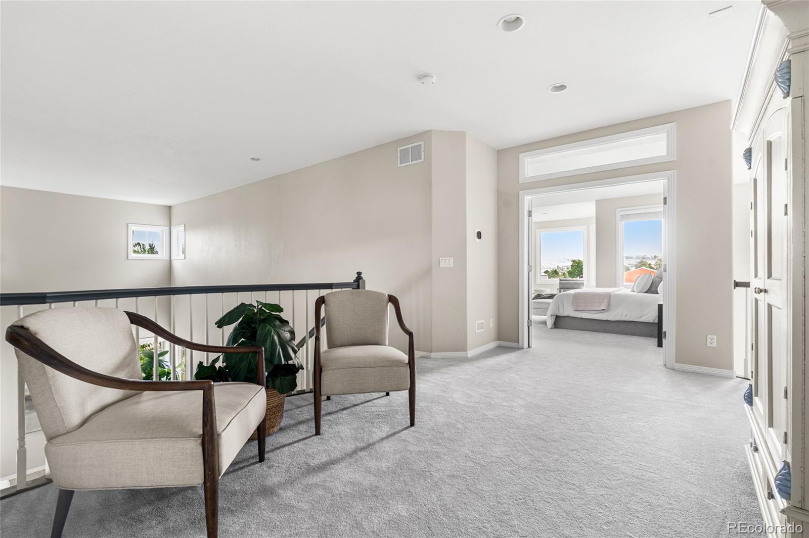 11041 Puma Run Lone Tree, CO 80124 - Photo 21 of 35 a living room with furniture and a table