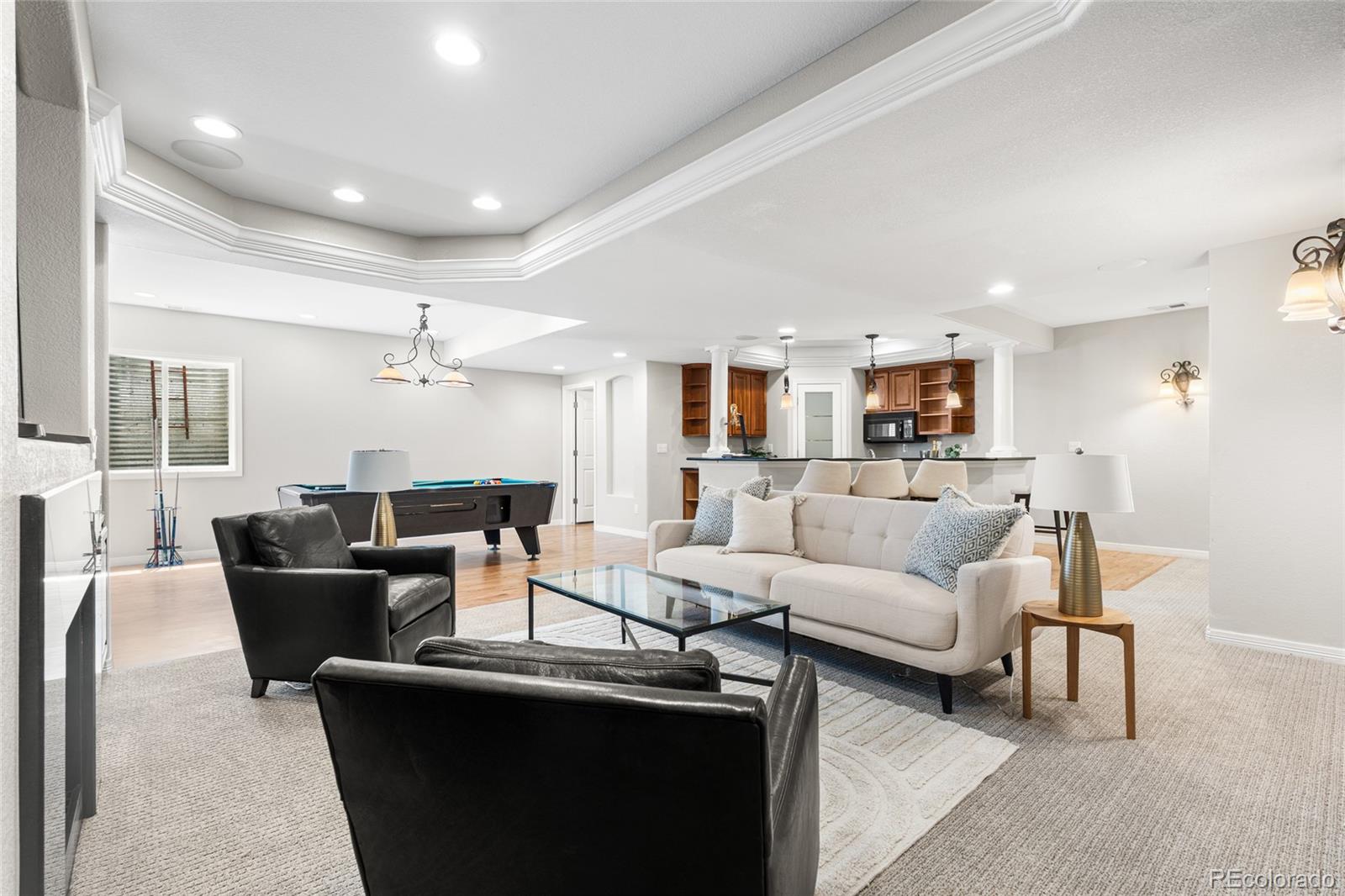 11041 Puma Run Lone Tree, CO 80124 - Photo 27 of 35 a living room with furniture and a large window