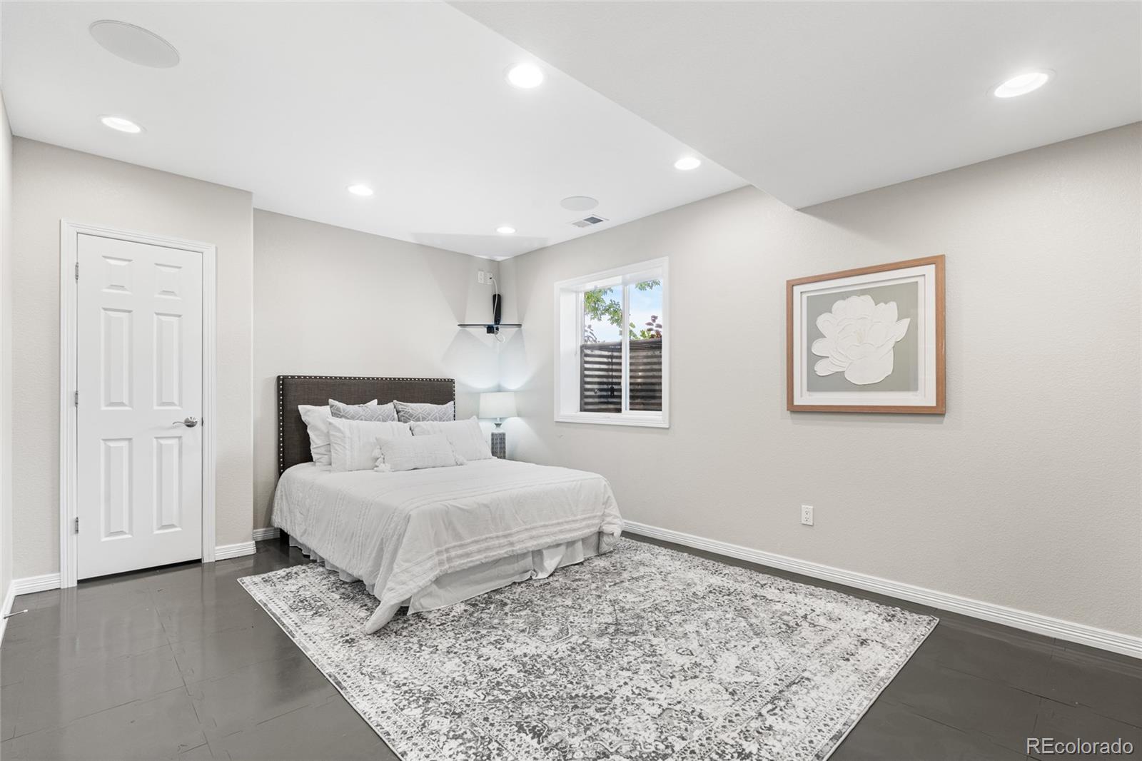 11041 Puma Run Lone Tree, CO 80124 - Photo 30 of 35 a bedroom with a bed and a window