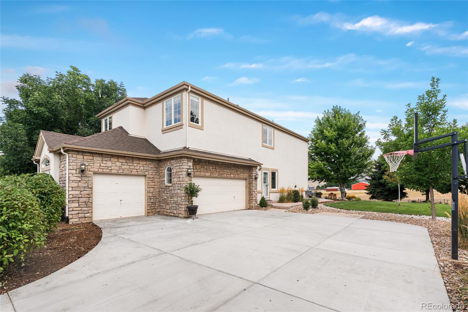 11041 Puma Run Lone Tree, CO 80124 - Photo 31 of 35 a front view of a house with a yard and garage