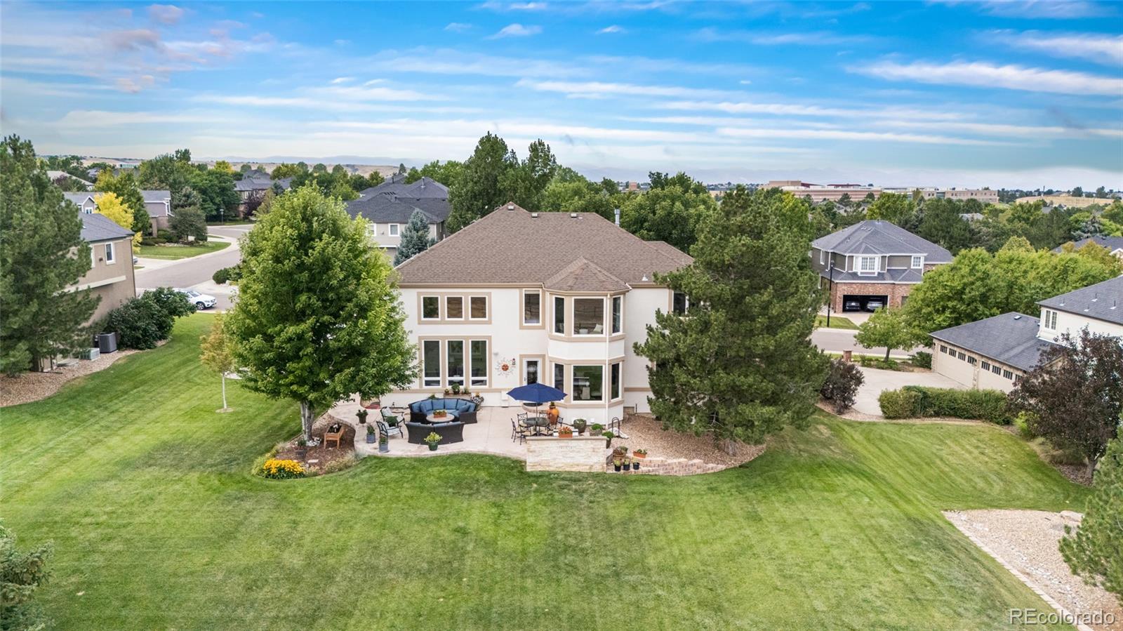 11041 Puma Run Lone Tree, CO 80124 - Photo 4 of 35 a view of a house with a garden and a yard