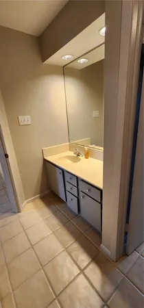 a room with a wooden cabinets and washing machine
