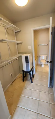 a bathroom with a sink mirror and toilet