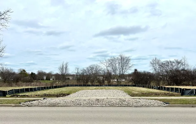 a view of a road with a big yard