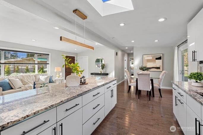 21904 88th Place West Edmonds, WA 98026 - Photo 14 of 40 a living room with granite countertop kitchen island furniture and white cabinets