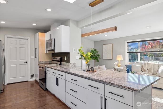 21904 88th Place West Edmonds, WA 98026 - Photo 15 of 40 a kitchen with granite countertop a sink and white cabinets