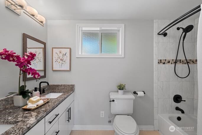 21904 88th Place West Edmonds, WA 98026 - Photo 27 of 40 a bathroom with a granite countertop sink toilet and shower