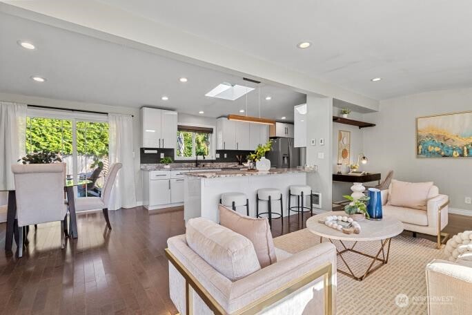 21904 88th Place West Edmonds, WA 98026 - Photo 3 of 40 a living room with fireplace furniture and a wooden floor