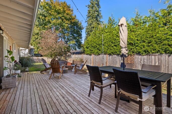 21904 88th Place West Edmonds, WA 98026 - Photo 32 of 40 a view of a table and chairs in patio of the house