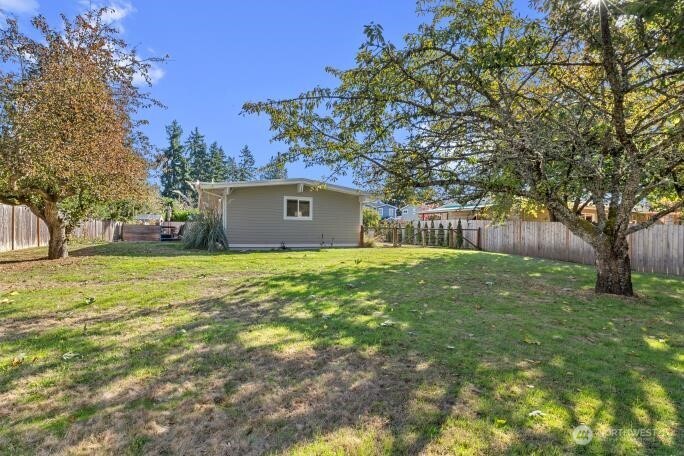 21904 88th Place West Edmonds, WA 98026 - Photo 35 of 40 a house view with a garden space