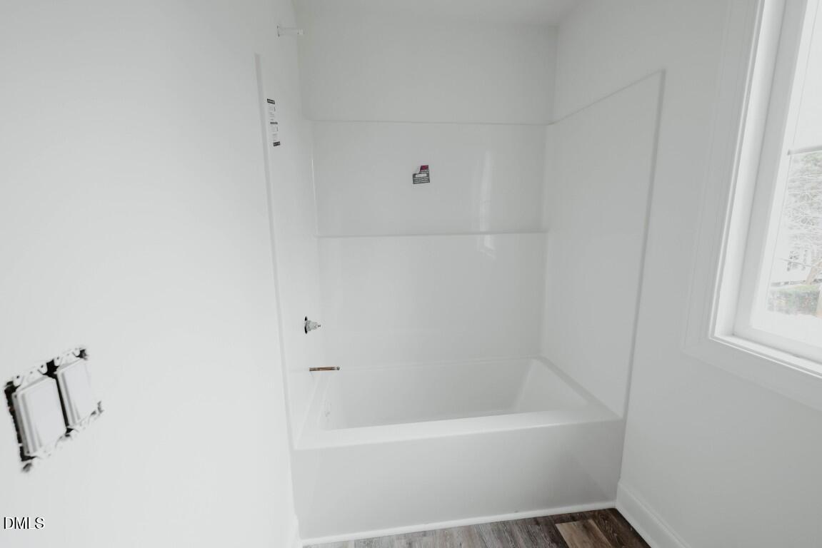 309 East Perry Avenue Wake Forest, NC 27587 - Photo 16 of 24 a bathroom with a bathtub