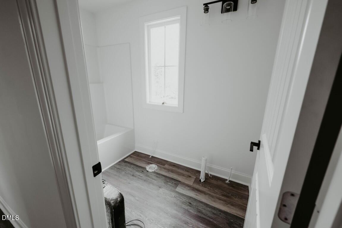 309 East Perry Avenue Wake Forest, NC 27587 - Photo 18 of 24 a bathroom with a granite countertop sink and a mirror