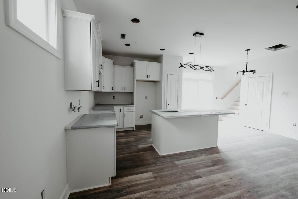 309 East Perry Avenue Wake Forest, NC 27587 - Photo 2 of 24 a view of kitchen with wooden floor and electronic appliances