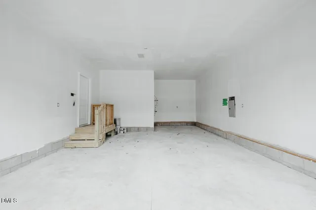 an empty room with a fireplace