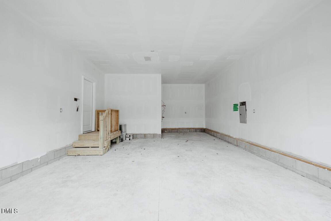 309 East Perry Avenue Wake Forest, NC 27587 - Photo 23 of 24 an empty room with a fireplace