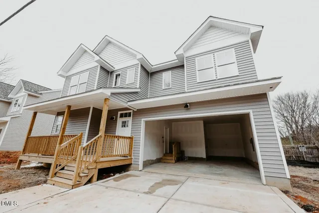 a view of a house with a balcony and stairs