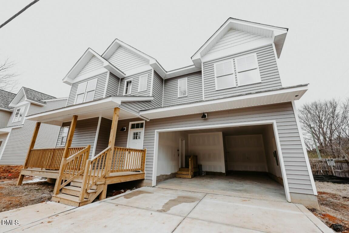 309 East Perry Avenue Wake Forest, NC 27587 - Photo 24 of 24 a view of a house with a balcony and stairs