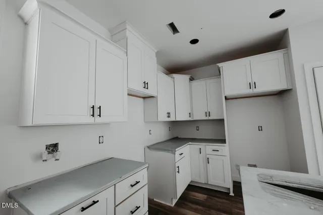 a view of cabinets with wooden floor
