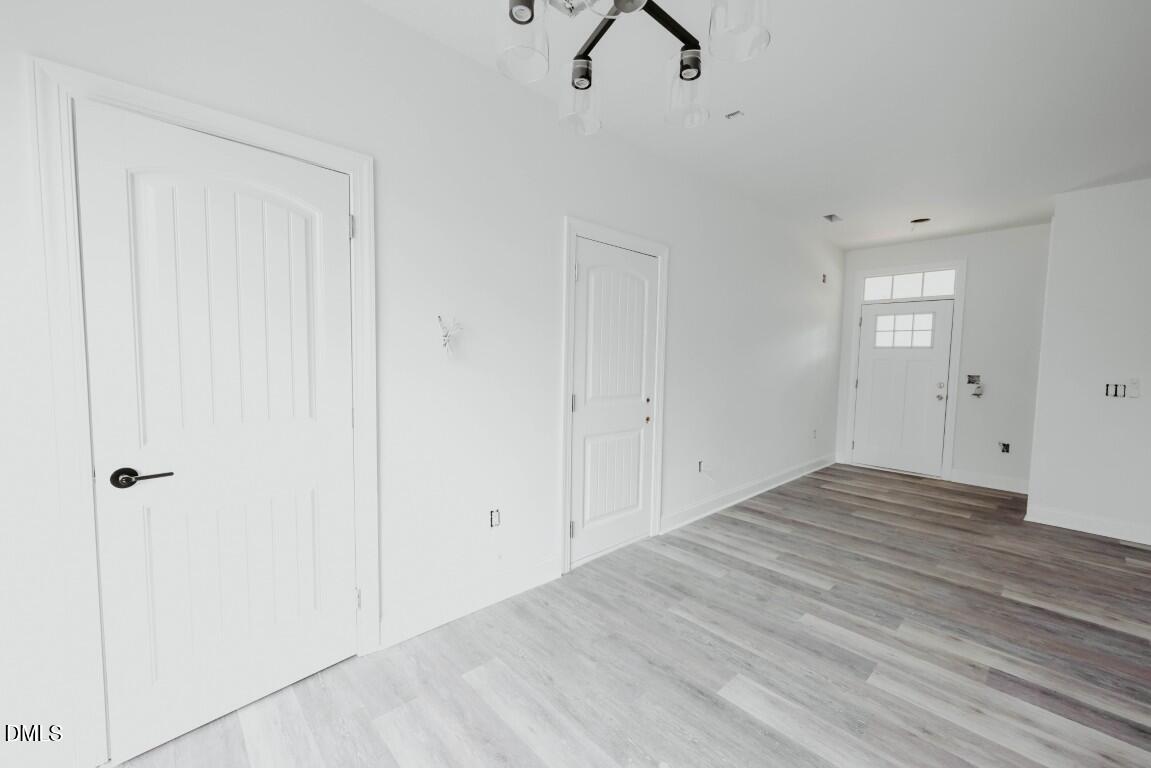 309 East Perry Avenue Wake Forest, NC 27587 - Photo 8 of 24 wooden floor in an empty room