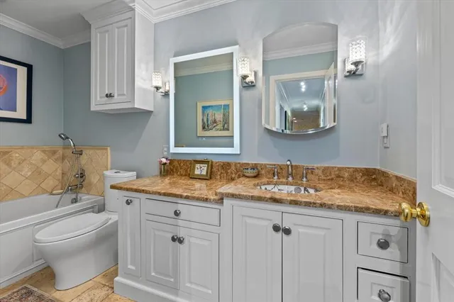 a view of a chair and table in backyard