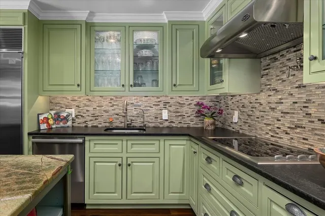 a kitchen with a sink and cabinets