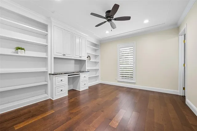 a view of a kitchen with a white cabinet and a stove top oven