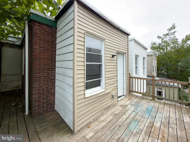 a view of a building with a bench in front of building