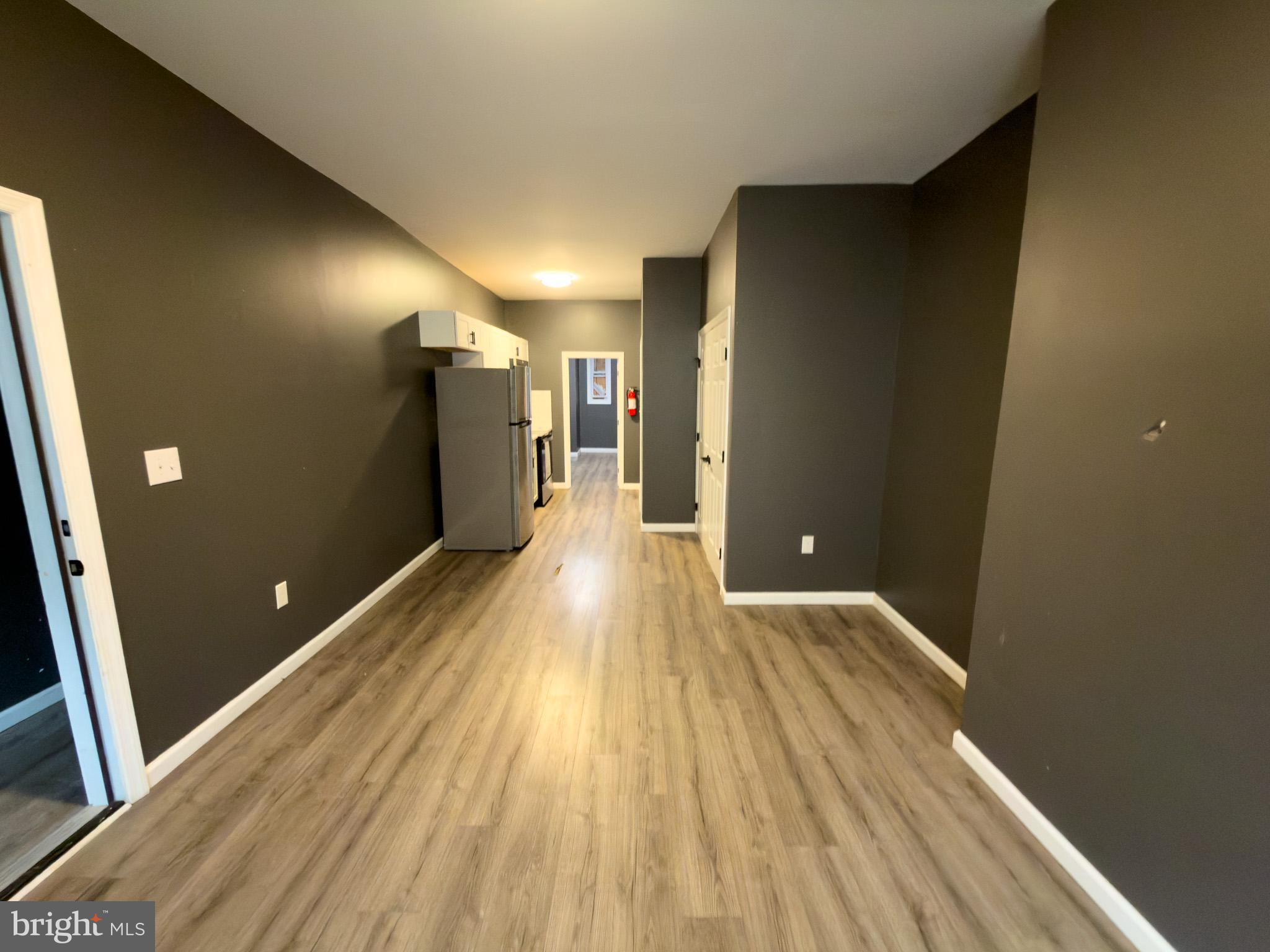 826 Union Street Philadelphia, PA 19104 - Photo 5 of 16 a view of a hallway with wooden floor