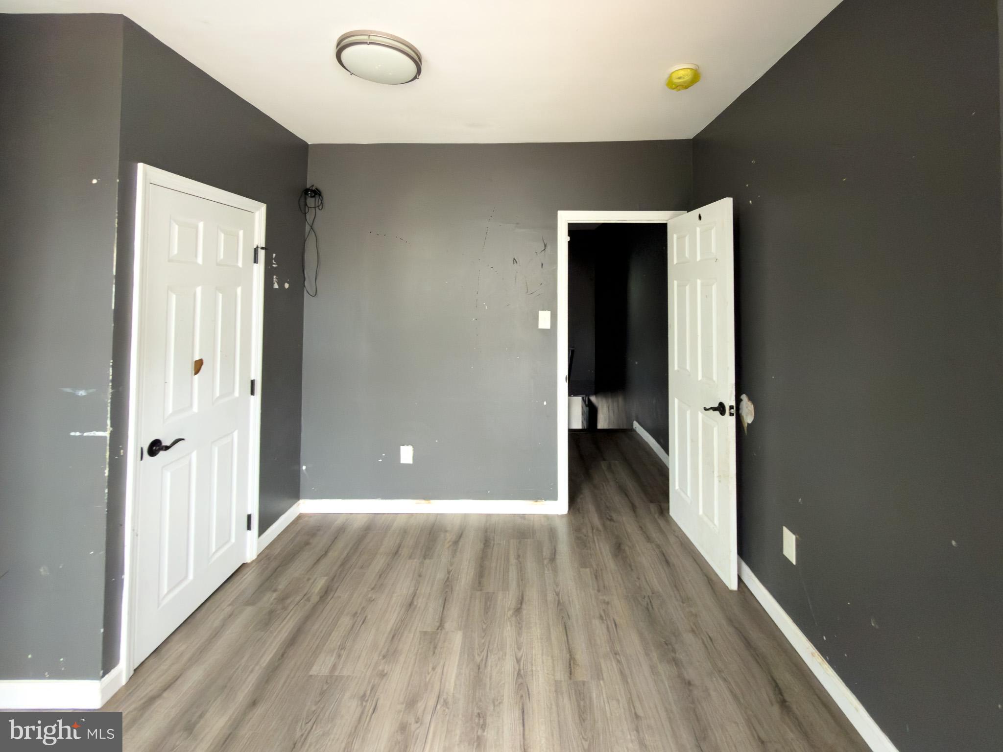 826 Union Street Philadelphia, PA 19104 - Photo 6 of 16 a view of a hallway with wooden floor
