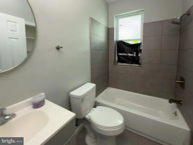 a bathroom with a sink and toilet