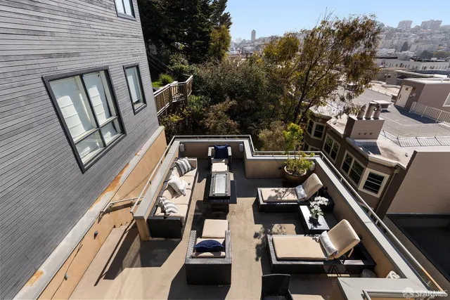 a view of a balcony with chairs
