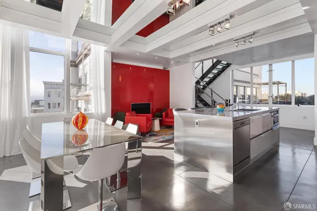 a view of kitchen with furniture and windows