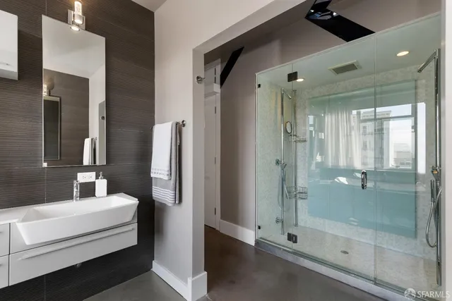a bathroom with a shower and a tub