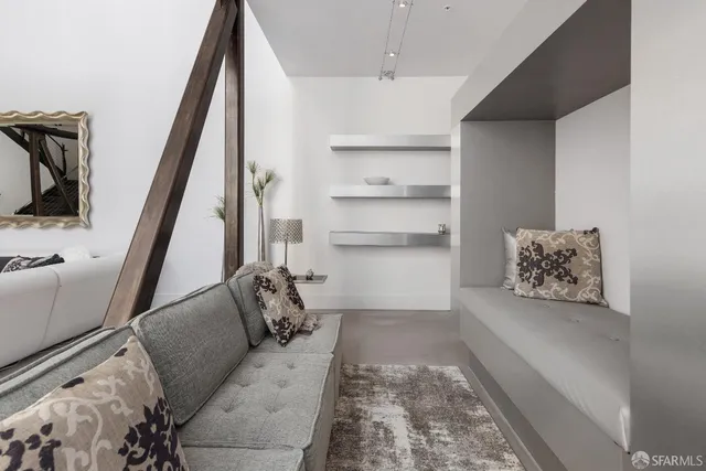 a living room with furniture and a rug