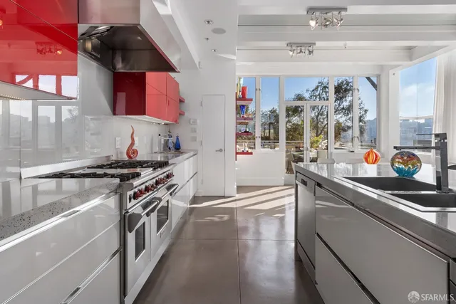 a kitchen with stainless steel appliances granite countertop a stove and a sink