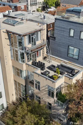 a aerial view of a house with a garden and plants