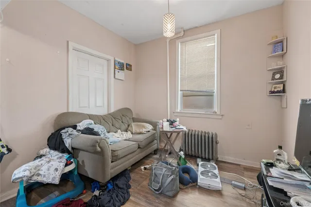 a bedroom with furniture and a window