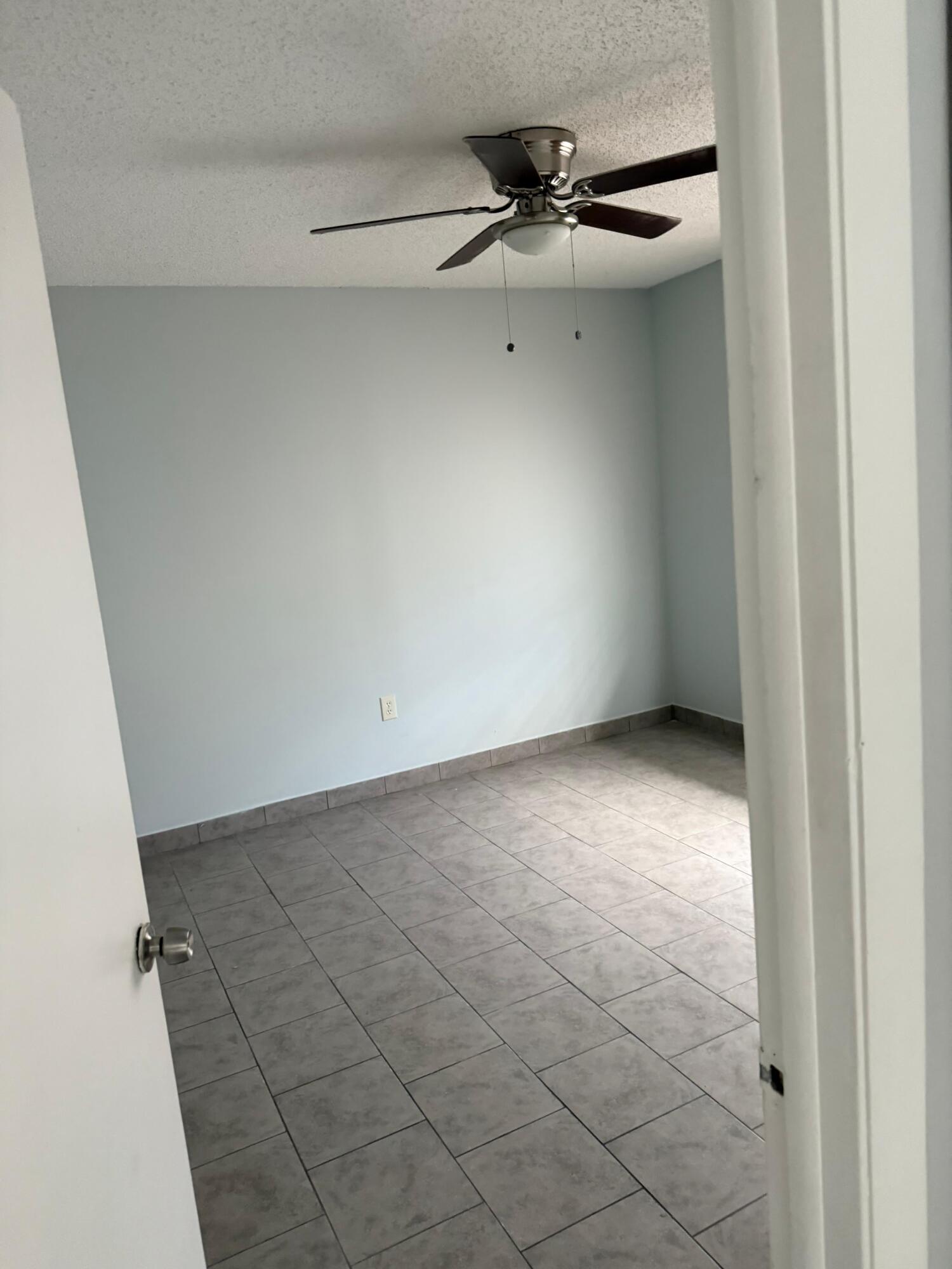 29714 Southwest 158th Place Homestead, FL 33033 - Photo 3 of 3 a view of an empty room with a window