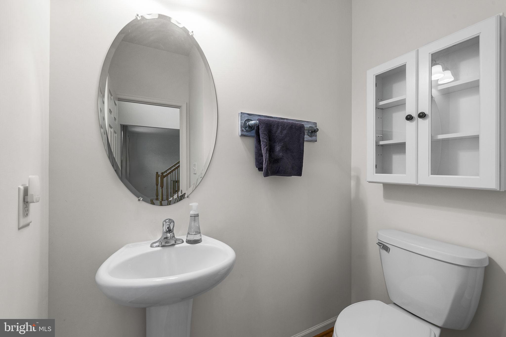 192 Matchbox Court Ranson, WV 25438 - Photo 11 of 50 a bathroom with a toilet sink and mirror