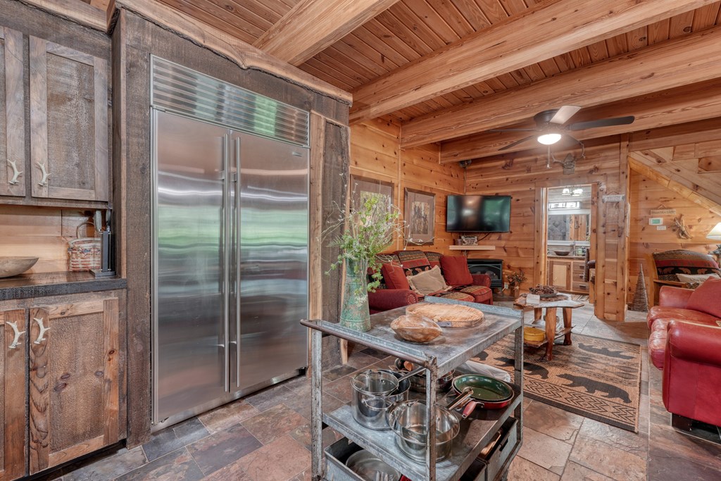 4836 Swallows Creek Road Hiawassee, GA 30546 - Photo 16 of 57 a outdoor space with lots of furniture and a glass door