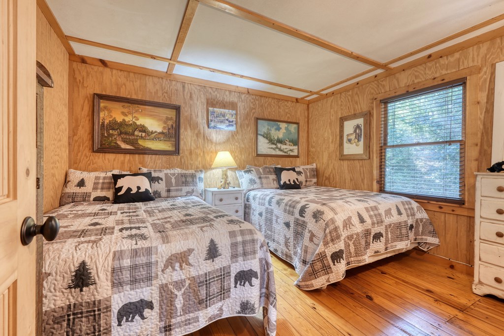 4836 Swallows Creek Road Hiawassee, GA 30546 - Photo 23 of 57 a bedroom with double bed and a window