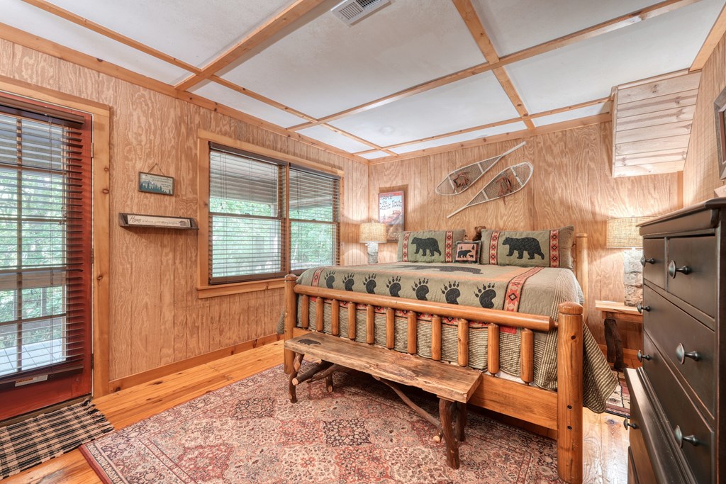 4836 Swallows Creek Road Hiawassee, GA 30546 - Photo 26 of 57 a view of a porch with wooden floor and outdoor seating