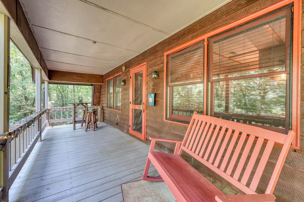 4836 Swallows Creek Road Hiawassee, GA 30546 - Photo 31 of 57 a balcony with chairs and wooden floor
