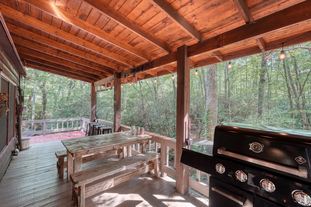 4836 Swallows Creek Road Hiawassee, GA 30546 - Photo 38 of 57 a living room with furniture and a flat screen tv